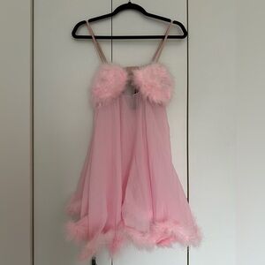 Femmebot costume with sheer feather duster robe